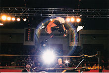 Van Dam performing the Five-Star Frog Splash in 1999