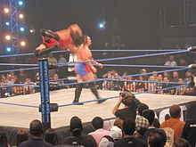 Van Dam performing a crossbody on Samoa Joe.