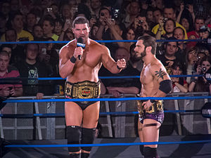 Roode and Austin Aries as tag team champions.