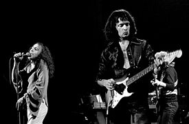 Dio performing with Rainbow. In the middle is Ritchie Blackmore. They first met when Dio's Elf opened for Deep Purple.