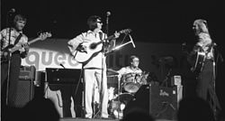 Orbison, center (in white), performing in 1976