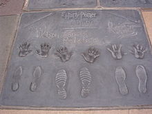 Handprints, footprints and wand prints of (from left to right) Watson, Radcliffe, Grint