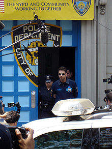 Russell Crowe escorted from NYPD in handcuffs on a perp walk to his arraignment for the phone throwing incident. 6 June 2005