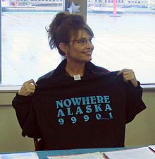 Palin holding a t-shirt while visiting Ketchikan during her Gubernatorial campaign in 2006; the ZIP code for the area is 99901.
