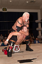 Scott Steiner executing his Steiner Recliner finisher against Petey Williams at a show in March 2013