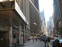 Bad Boy Entertainment Worldwide headquarters on Broadway near Times Square. A billboard of Combs is in the distance.