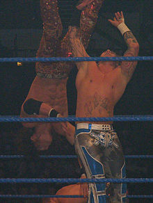 Moore performing a back body drop on John Morrison.