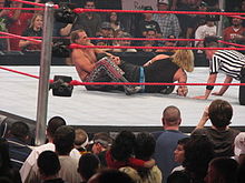 Michaels applying a modified figure four leglock on Jeff Hardy