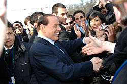 Berlusconi salutes the crowd on the EPP summit in 2009.