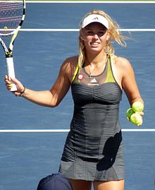 "Stella McCartney" reads beneath the Adidas logo on this dress worn by Caroline Wozniacki at the 2010 US Open.