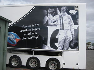 Modern advertisement with McQueen photo and quote.