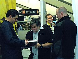 Steve Wozniak signs a Modbook for a fan during an appearance at the Axiotron booth during Macworld Expo 2009.