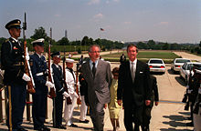 Secretary of Defense William S. Cohen escorts Spielberg through a military honor cordon into the Pentagon.