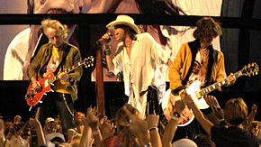 Tyler performing alongside bandmates Joe Perry and Brad Whitford at an Aerosmith performance on the National Mall in 2003.