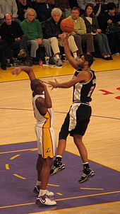 Duncan going up for a shot over the Lakers' Andrew Bynum
