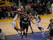 Duncan (#21) attempts to block Kobe Bryant's shot in a game against the Los Angeles Lakers at the Staples Center.