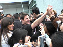 Cruise and Katie Holmes interacting with fans in 2006