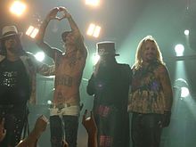 Mötley Crüe from left to right: Nikki Sixx, Lee, Mick Mars, and Vince Neil.