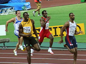 Gay leading in the 200 m against (left to right) Anastasios Gousis, Usain Bolt and Churandy Martina.
