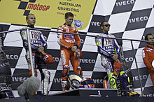The podium after the 2010 Australian Grand Prix, with Casey Stoner flanked by Jorge Lorenzo and Rossi.