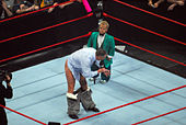 Vince McMahon commands Hornswoggle to join his "Kiss My Ass Club" in 2008