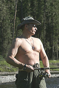 Vladimir Putin in Tuva, fishing in 2007. Putin often supports a tough guy image in the media.