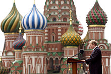 Putin speaking at the 2005 Victory Day Parade on Red Square. Saint Basil's Cathedral is on the background.