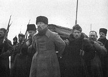 Pallbearers carrying Lenin's coffin during his funeral, from Paveletsky Rail Terminal to the Labor Temple. Felix Dzerzhinsky at the front with Timofei Sapronov behind him and Lev Kamenev on the left.
