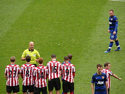 Rooney lines up a free kick against Sunderland on the final day of the 2011–12 Premier League season.