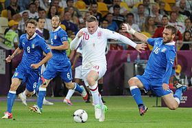 Rooney taking on the Italian defence at UEFA Euro 2012.