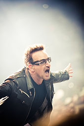 Bono performing with U2 in 2011