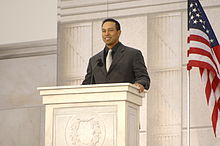 Woods giving a speech at We Are One: The Obama Inaugural Celebration at the Lincoln Memorial (January 2009)