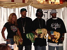 From left: With Olivia, Lloyd Banks, and Young Buck in Bangkok, Thailand, February 2006