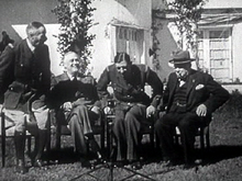 Rival French leaders Henri Giraud (left) and Charles de Gaulle sit down after shaking hands in presence of Franklin D. Roosevelt and Winston Churchill (Casablanca Conference, 14 January 1943) – a public display of unity, but the handshake was only for show.[39]