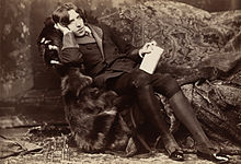 Oscar Wilde reclines with Poems for Napoleon Sarony in New York in 1882. Wilde often liked to appear idle, though in fact he worked hard; by the late ’80s he was a father, an editor, and a writer.[56]