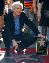 Cameron receiving a star on the Hollywood Walk of Fame in December 2009