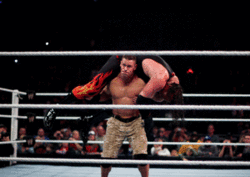 Cena performs an Attitude Adjustment on Kane.