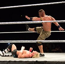 Cena delivers the Five Knuckle Shuffle to Dolph Ziggler.