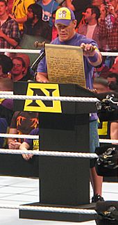 Cena being forced to read a public address by Wade Barrett while a member of Nexus.