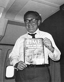 Aboard Air Force One, Kissinger expresses delight at being named TIME Magazine's "Man of the Year," along with President Richard Nixon, 1972