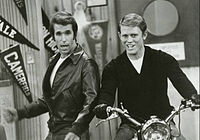 Richie takes a turn on Fonzie's motorcycle