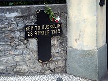 Cross marking the place in Mezzegra where Mussolini was shot.