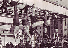 The dead body of Mussolini (second from left) next to Petacci (middle) and other executed fascists in Piazzale Loreto, Milan, 1945