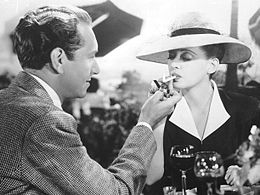 Paul Henreid lights Davis's cigarette in Now, Voyager (1942), one of her most iconic roles