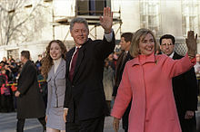 President Bill Clinton (center), first lady Hillary Rodham Clinton (right) and their daughter Chelsea (left) wave to watchers at a parade down Pennsylvania Avenue on Inauguration Day, January 20, 1997.
