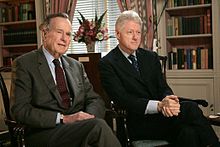 Clinton with former President George H. W. Bush in January 2005