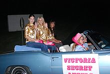 Victoria's Secret Angels Adriana Lima (left), Marisa Miller and Selita Ebanks ride in the Guantanamo Bay Christmas Parade Dec 1, 2007 in a Cadillac Eldorado