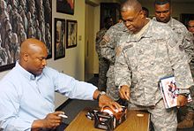 Jackson signing autographs for US Soldiers in September 2007.