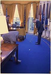 Bob Hope, a golf fan, putting a golf ball into an ashtray held by President Richard Nixon in the Oval Office in 1973