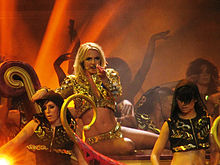 Spears performing "Gimme More" at the Femme Fatale Tour (2011).